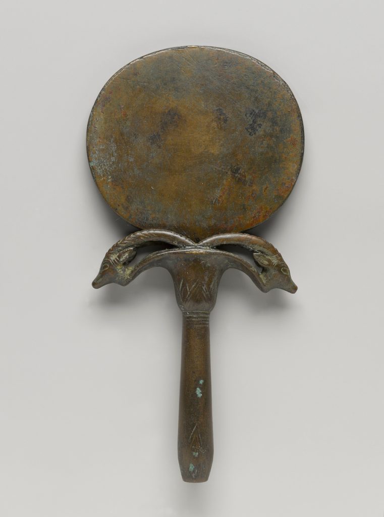Mirror with Handle in Form of Umbel with Two Ibex Heads, circa 1539-1292 B.C.E. Bronze, Other (handle): 4 ¼ x 3 ½ x ¾ in. (10.7 x 9 x 2 cm). Charles Edwin Wilbour Fund, 75.168a-b. (Photo: Jonathan Dorado, Brooklyn Museum)